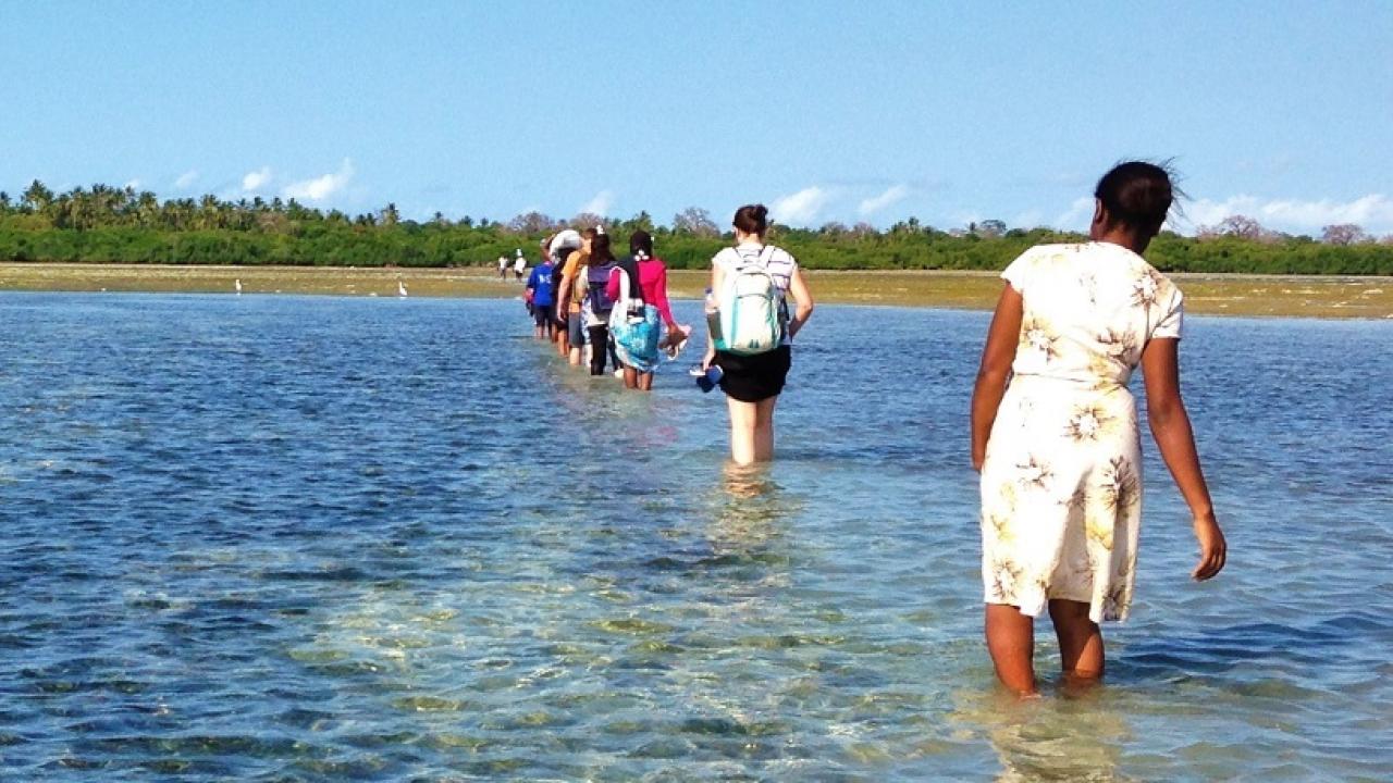 AMA team hiking through ocean