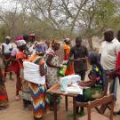 Enumerators discussing seed bundle